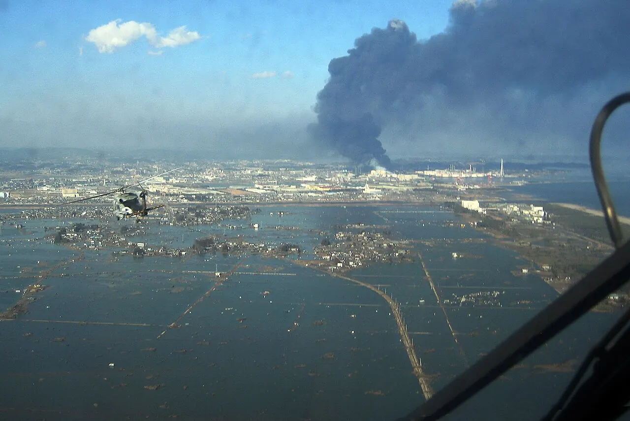 US Navy helicopter surveys Sendai coast after 2011 Tohoku earthquake